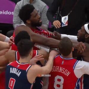 Joel Embiid did not like that foul by Harrell and the two just got in a minor scuffle